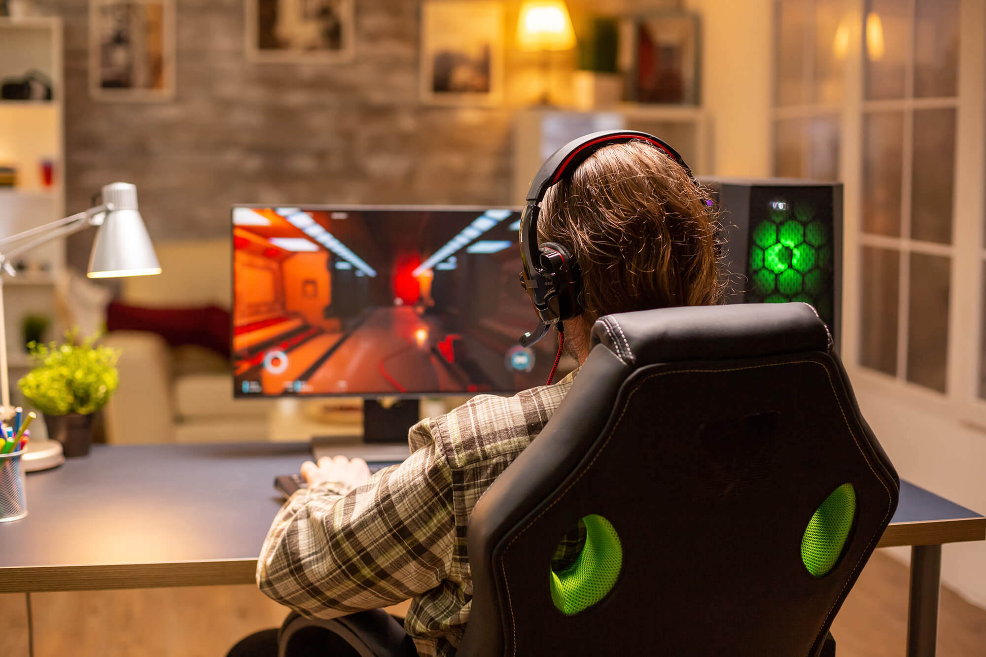 back-view-gamer-male-playing-shooter