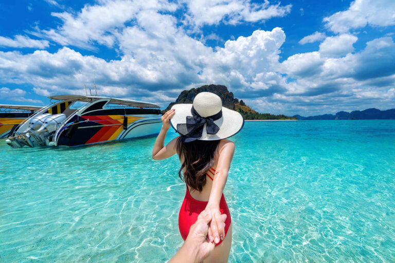 bikini-girl-holding-man-s-hand-leading-him-ocean-krabi-thailand