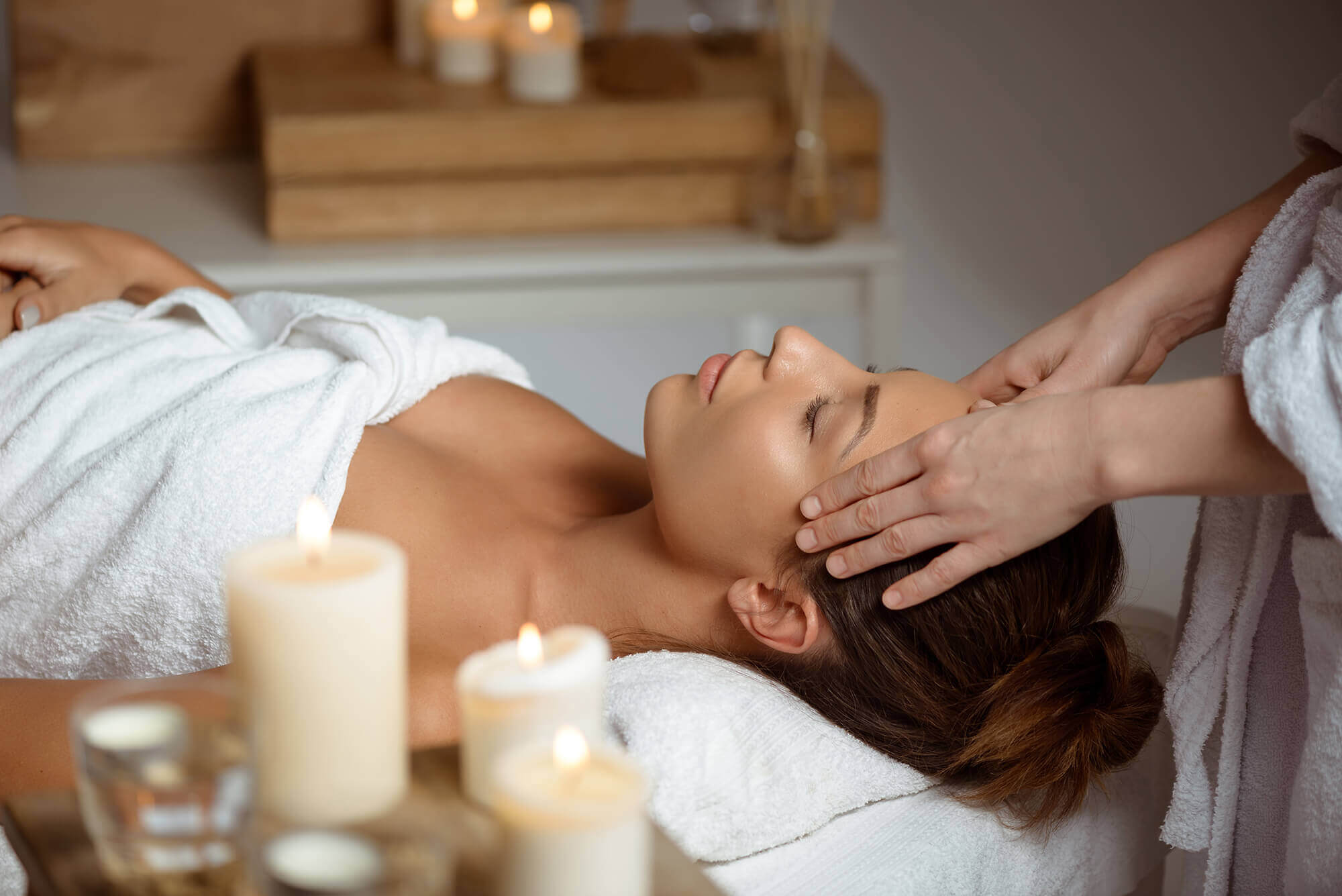 young-woman-having-face-massage-relaxing-spa-salon