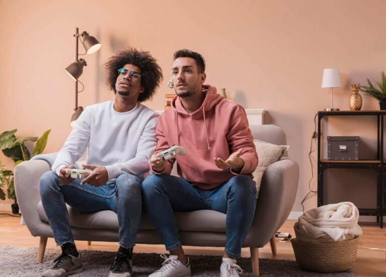 male-friends-playing-with-joystick_23-2148405655